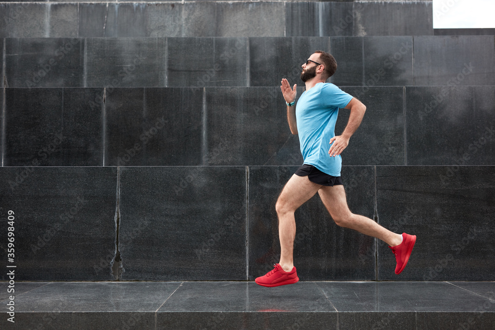 Modern sporty man jogging / exercise in urban environment. Modern sporty man jogging / exercise in urban environment.