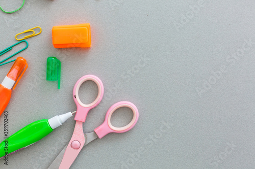 Material for school, paper clips, pencils, colors, scisor and notebook photo