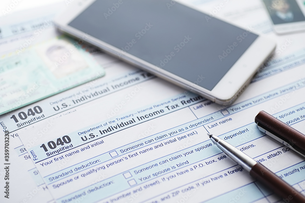 Annual tax reporting. Tax form on the table. Financial statements for signature. Annual tax reporting. Tax form on the table. Financial statements for signature.