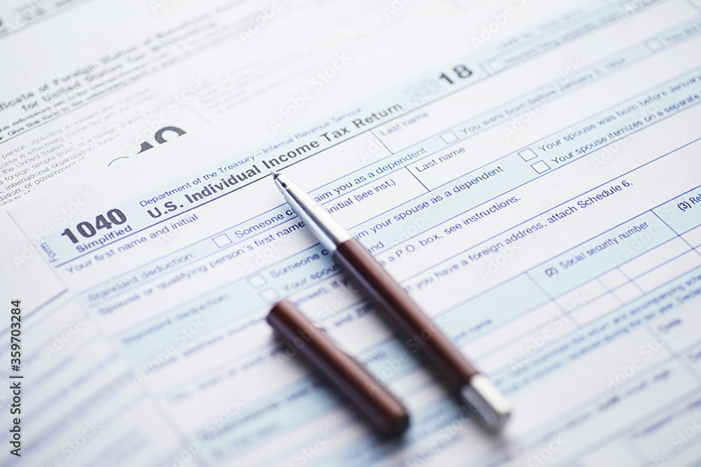 Annual tax reporting. Tax form on the table. Financial statements for signature. Annual tax reporting. Tax form on the table. Financial statements for signature.