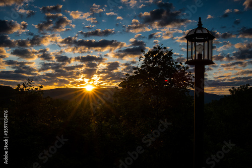 Sunrise over Mountain with Lamp Post