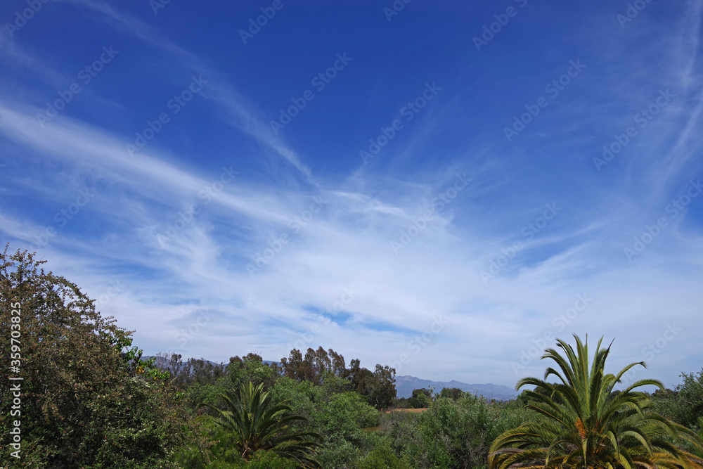 Fantastic sky and clouds view over the a southern California landscape panorama with the Santa Ynez mountains in the background