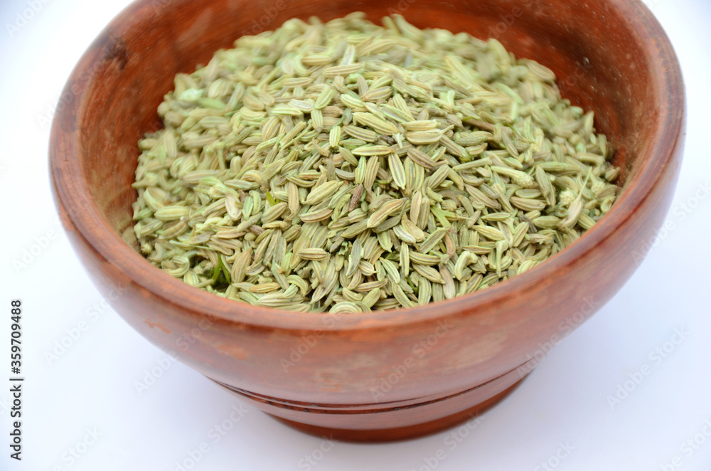anise seeds in the brown bowl. anise seeds in the brown bowl.
