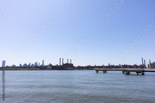 Wide Manhattan Skyline along the East River seen from Brooklyn New York