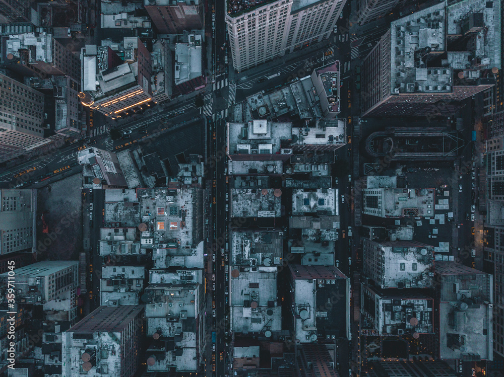 Aerial Overhead View of Manhattan, New York City Streets right after dusk with street lights