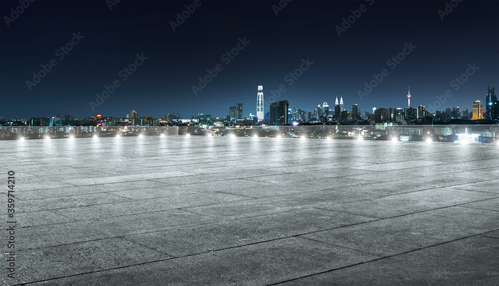 Empty floor with cityscape in night view.