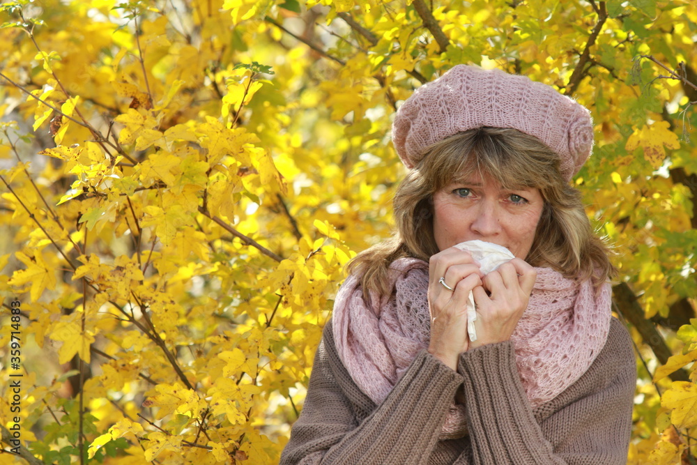 Senior woman with flu in autumn Senior woman with flu in autumn