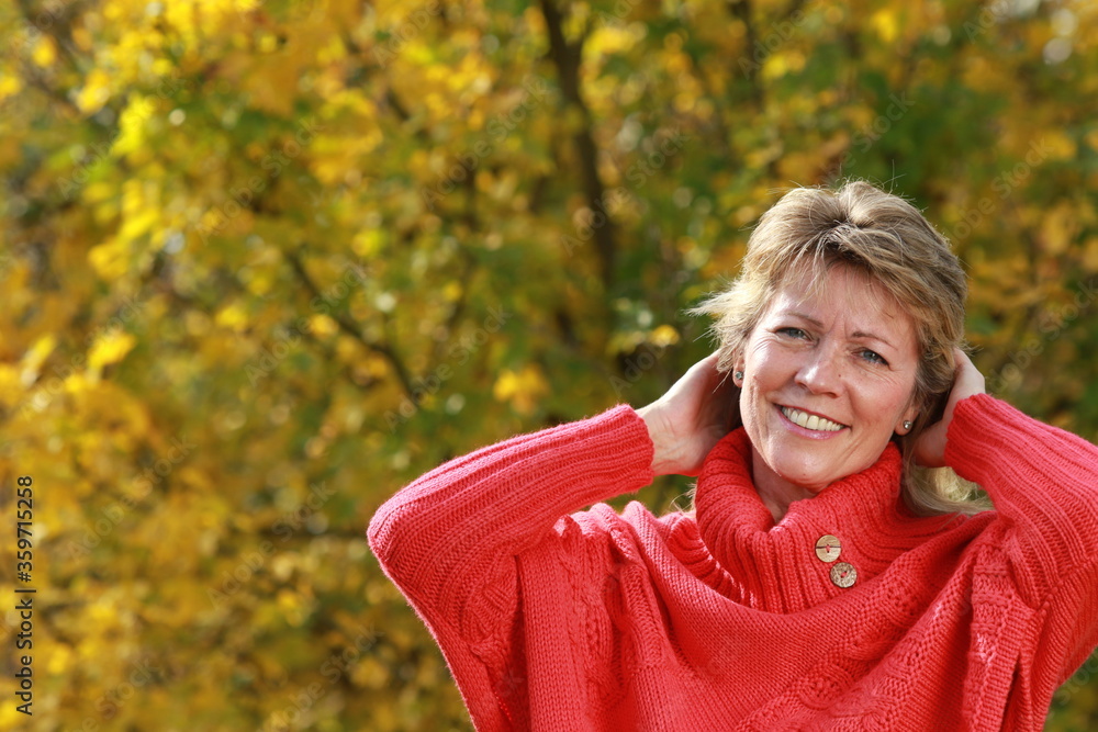 Happy mature woman with hands behind her head Happy mature woman with hands behind her head
