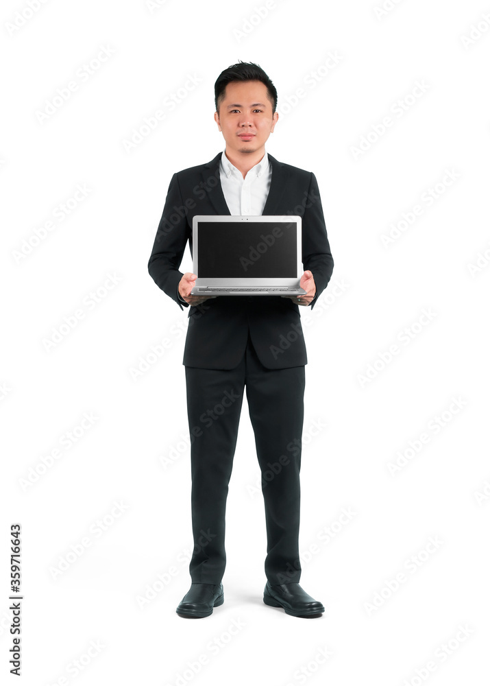 Businessman holding laptop with a blank screen, isolated white background.