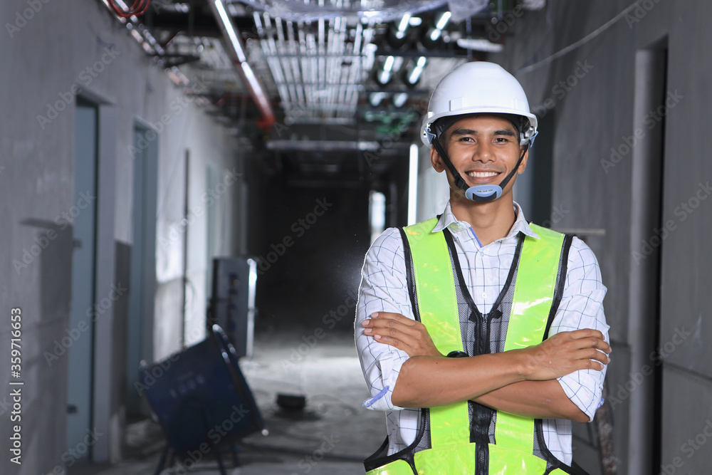 Successful male engineer in the building that supervises the construction Successful male engineer in the building that supervises the construction