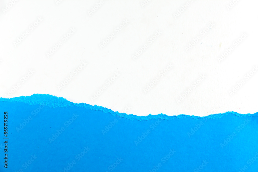 divided halves of the sheet of blue ripped paper on white background divided halves of the sheet of blue ripped paper on white background