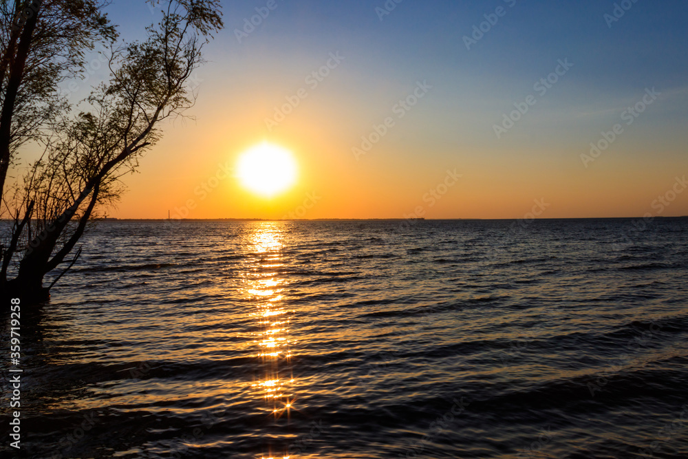 View of calm lake at sunset