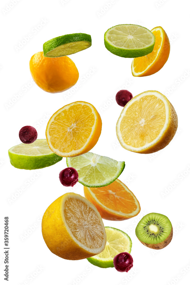 Falling fresh mixed citruses. Slices of the lemon, kiwi, cherry,and lime the air Falling fresh mixed citruses. Slices of the lemon, kiwi, cherry,and lime the air