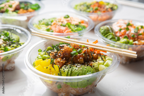 Photography Closeup of Japanese takeaway food, poke bowls.