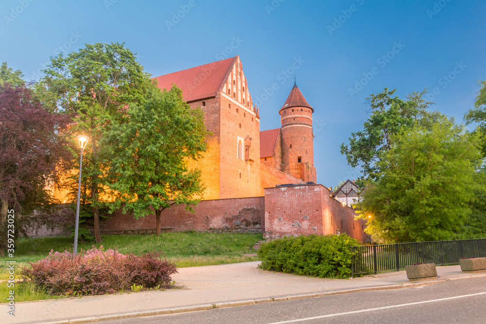 Gothic castle of Warmian Bishops in the evening in Olsztyn, Poland.