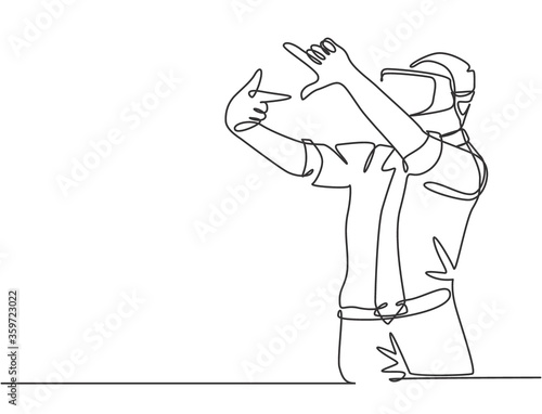 Single continuous line drawing of young male worker gesture forming square shape from his finger while playing augmented reality game. Virtual reality concept one line draw design vector illustration