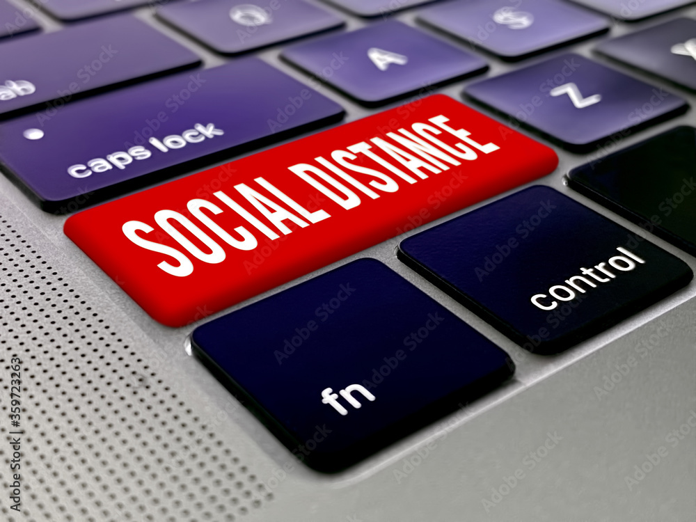 Fototapeta premium Social distancing key on a laptop keybord