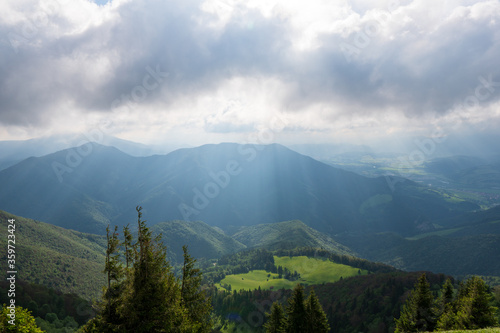 Green meadow in mountain and blue cloud sky. Composition of nature. Spring meadow. Composition of nature. Slovakia