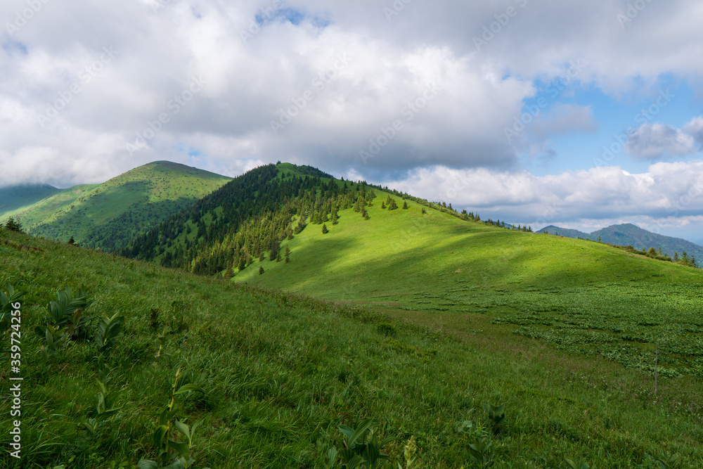 Green ridge in mountain and blue cloud sky. Composition of nature. Spring ountain. Composition of nature. Slovakia little fatra europe