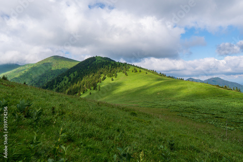 Green ridge in mountain and blue cloud sky. Composition of nature. Spring ountain. Composition of nature. Slovakia little fatra europe