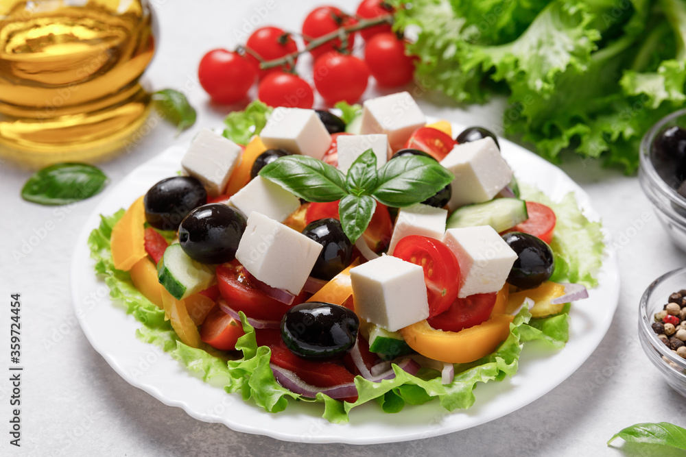Greek salad with cheese and fresh vegetables on white background. Greek salad with cheese and fresh vegetables on white background.