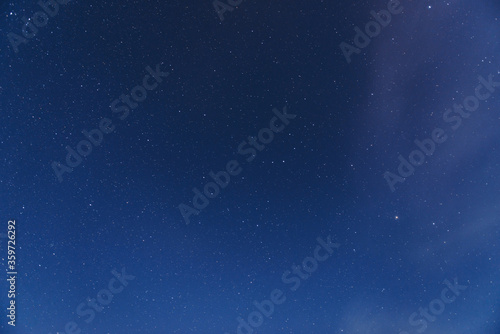 Stars in the night sky with clouds  a beautiful astronomical background
