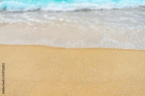 Fototapeta Naklejka Na Ścianę i Meble -  close up sand beach with blue sea wave background