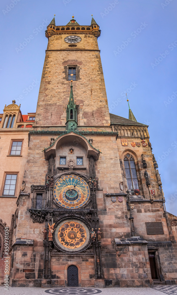 The Old Town Square with Old Town Hall Clock Tower in the center and people walking in the street in Prague, Czech Republic: 