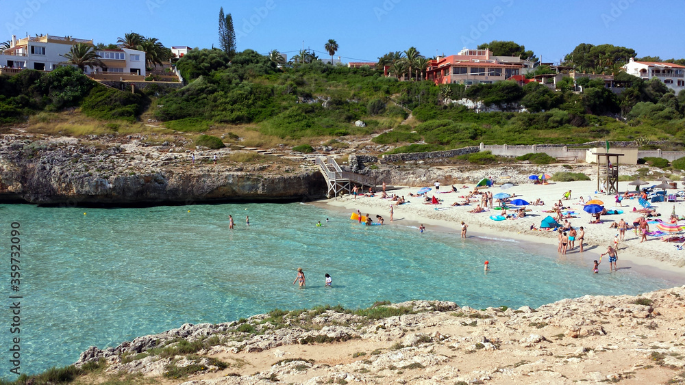 People in the water on Cala Domingos Beach, Calas de Mallorca, Spain