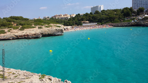 People in the water on Cala Domingos Beach, Calas de Mallorca, Spain © abrada