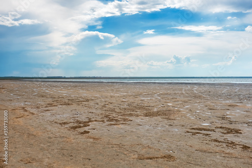 Lake Ebeity (Omsk region, Russian Federation), large salt lake with therapeutic mud. Beautiful natural view of pond and blue sky. Trip on weekend. photo