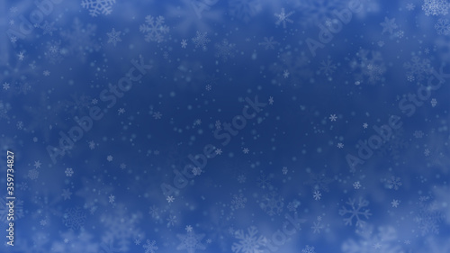 Christmas background of snowflakes of different shapes  sizes  blur and transparency in blue colors