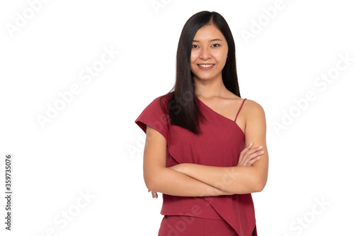 Portrait of young asian woman with arms crossed and looking at camera isolated on white background