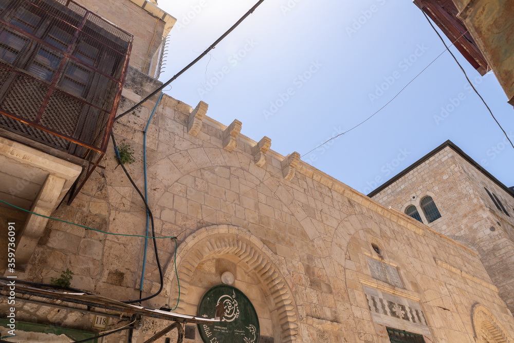 Old buildings on Shaar Shalshelet Street in the Arab Quarter in the old city of Jerusalem, Israel