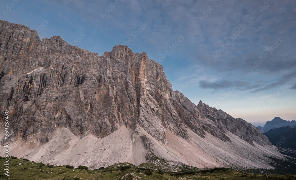 Spectacular view of Civetta mountain range with Civetta summit at its center from the terrace of Tissi refuge at the golden hours before sunset, Dolomites, Alleghe village, Belluno province, Italy.