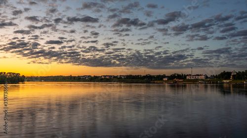 Fototapeta Naklejka Na Ścianę i Meble -  City panorama with river embankment and twilight sky. Uglich, Russia.