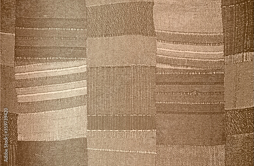 Distressed overlay texture of golden weaving fabric, knitted blanket with tartan ornament. grunge background.