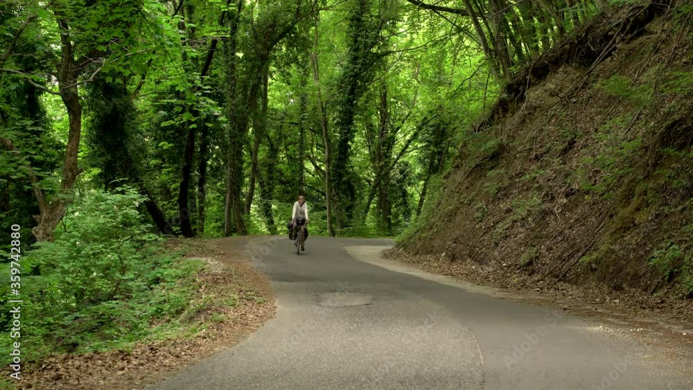 Man cycling through calm road, Zumberak national park, Croatia. Man cycling through calm road, Zumberak national park, Croatia.