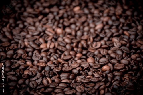 a heap of black coffee beans © Denis