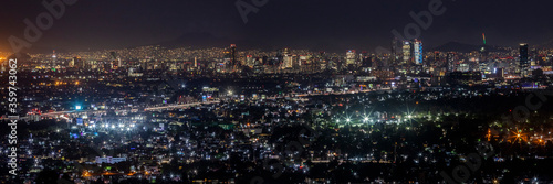 Panorámica nocturna de la Ciudad de México con avenida periférico y principales edificios photo
