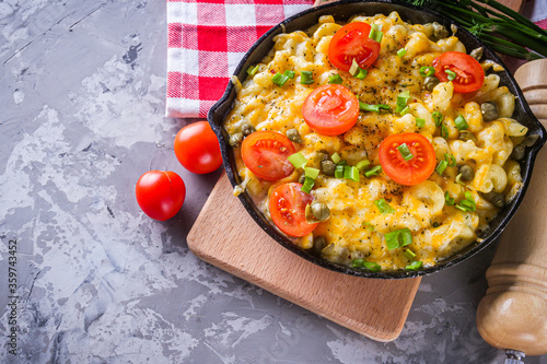 delicious pasta and cheese casserole in a cast iron skillet photo