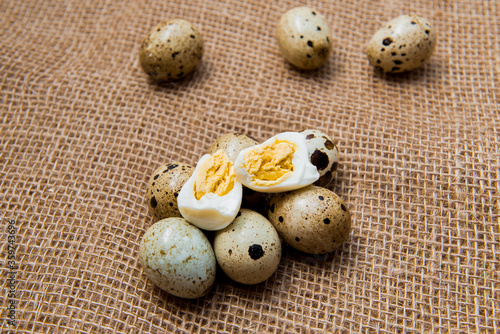 Food: group of quail eggs isolated on burlap