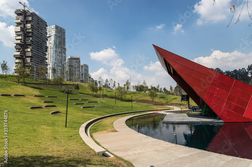 Open air forum and artifical lake inside La Mexicana urban park in Santa Fe, Mexico City, beside modern residential buildings photo
