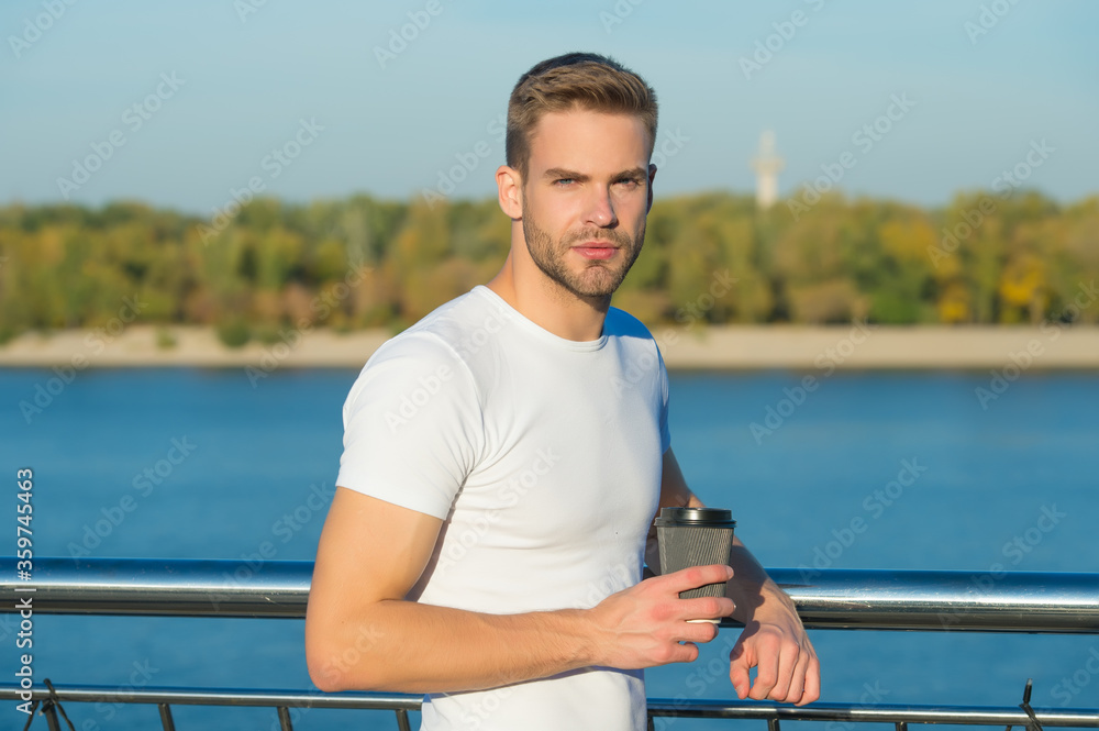 Summer rest. Place of power. Man hipster relaxing at riverside nature background. Handsome guy outdoors sunny day. Summer vacation destinations. Relaxing alone with his thoughts. Summer morning