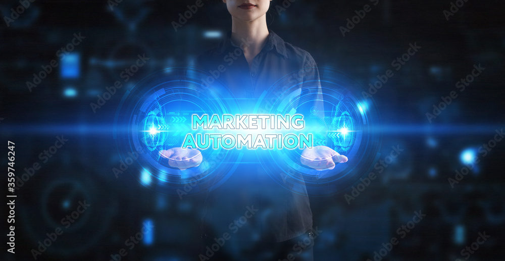 Business, Technology, Internet and network concept. Young businessman working on a virtual screen of the future and sees the inscription: Marketing automation