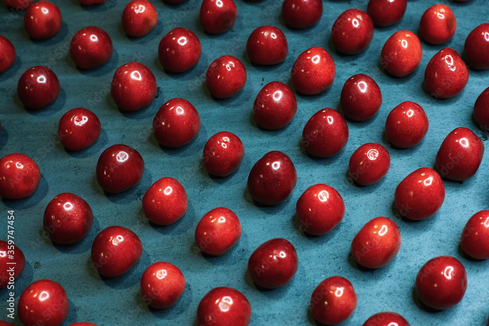 Cherry photographed at an angle on a black background horizontally Cherry photographed at an angle on a black background horizontally