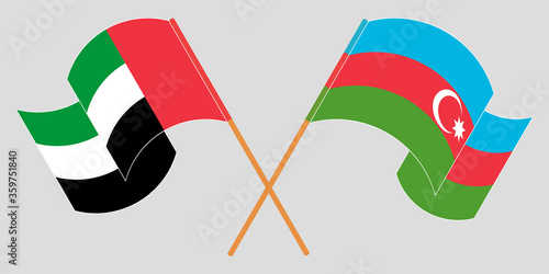 Crossed and waving flags of Azerbaijan and the United Arab Emirates