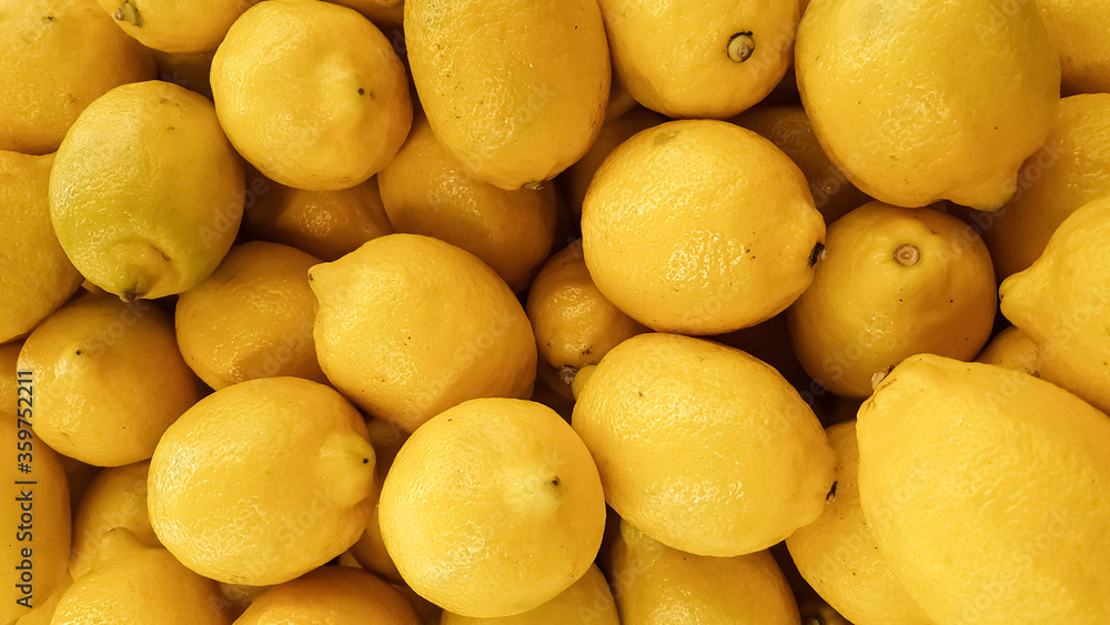 .colorful fresh juicy lemons in supermarket