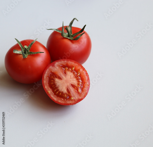 ripe tomatoes on a white background close up