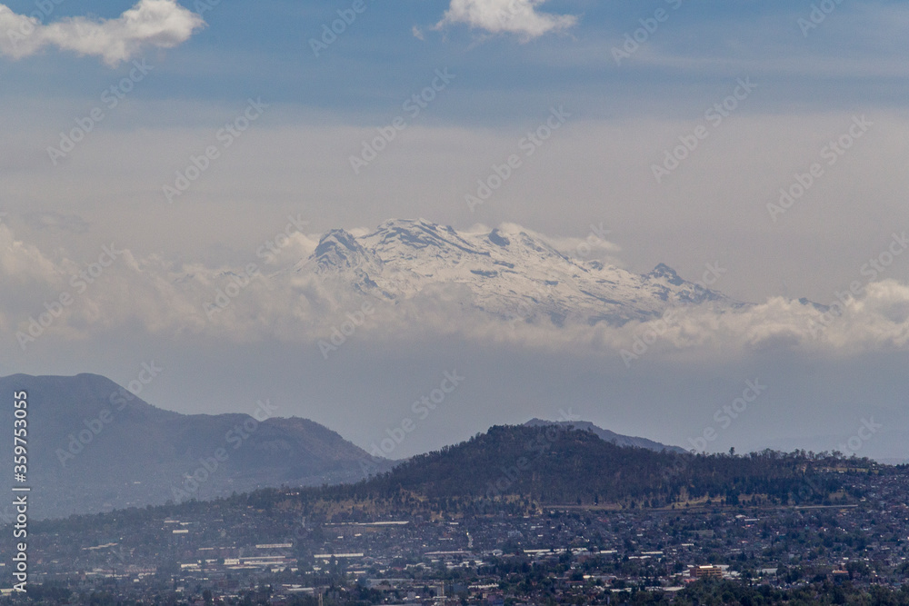 Aerial view of snowed Iztaccíhuatl volcano in Mexico City